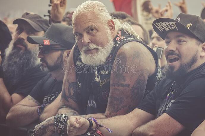 expressive-old-metalhead-many-tattoes-long-hairs-rings-first-line-concert-156006009