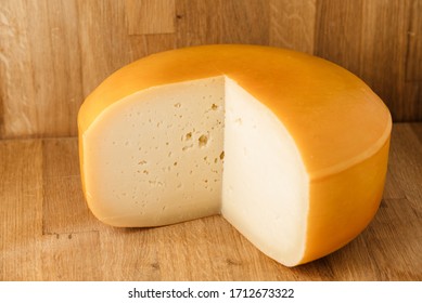 big-piece-cheese-on-wood-260nw-1712673322